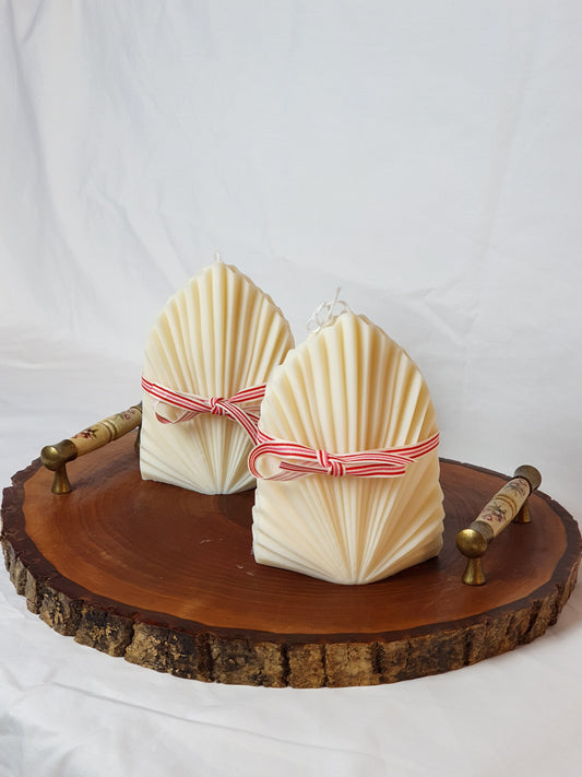 Two Ivory Big Palm Leaf Shape Soy Candle on a wooden tray with white background