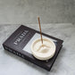 Lip Incense Holder with incense stick on it.